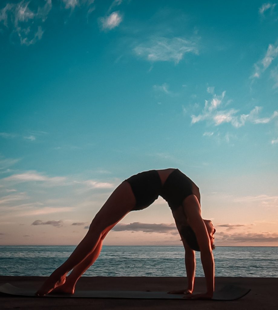 alt= yoga chakrasana variation